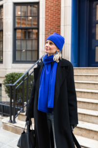 MERRITT BECK IN A GUEST IN RESIDENCE CASHMERE COBALT SWEATER, SCARF AND BEANIE