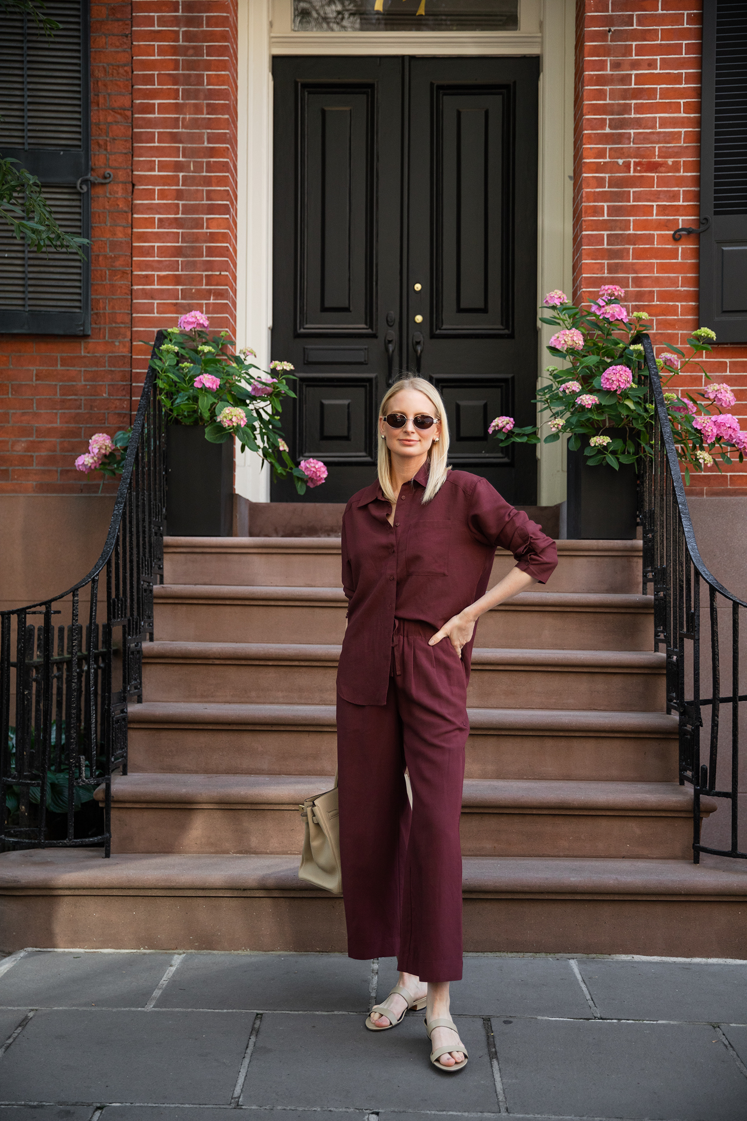Merritt Beck in a Nordstrom button-up shirt and wide leg crop pants in Brown Raisin