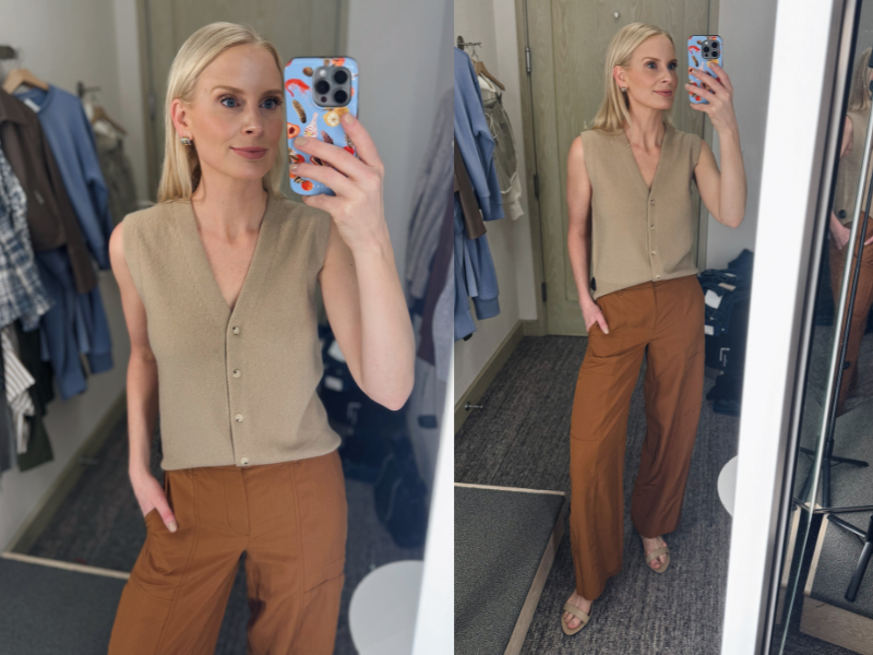 MERRIT BECK TRYING ON BROWN PANTS AND SLEEVELESS SWEATER