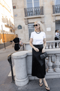 MERRITT BECK IN A STUART WEITZMAN RIO SANDALS