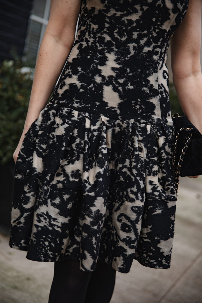 Merritt Beck in a vintage Dior dress and velvet Chanel bag