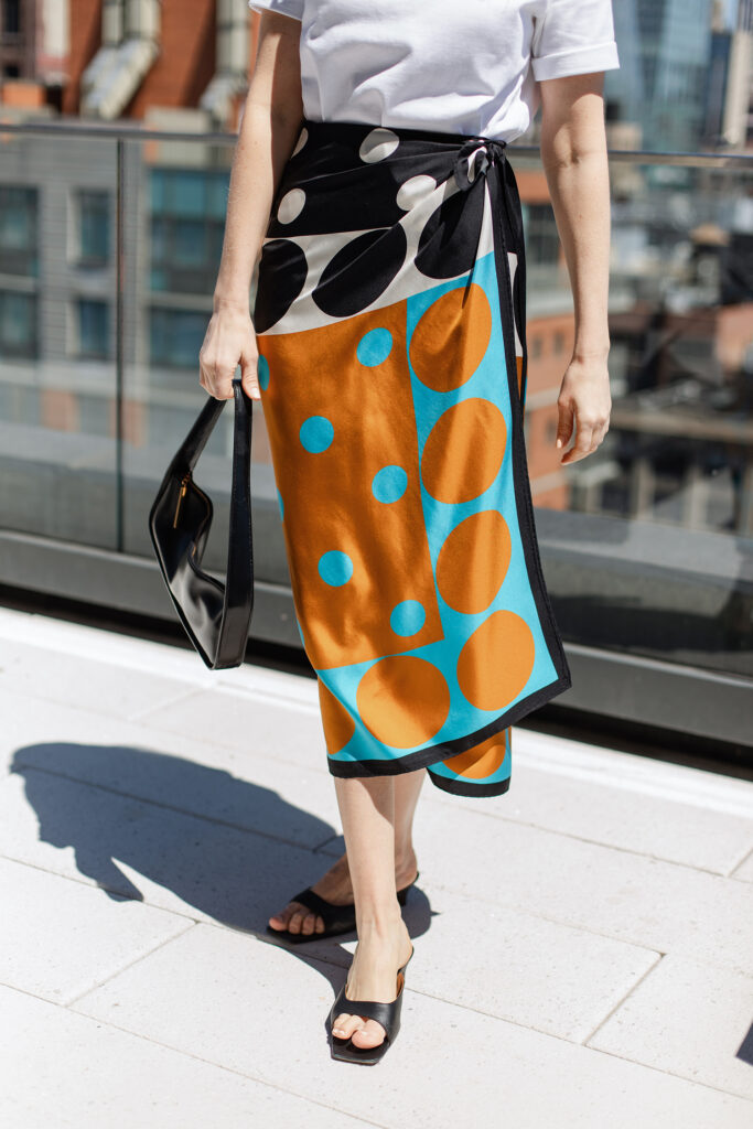 MERRITT BECK IN A DRIES VAN NOTEN SILK PAREO SKIRT ON A ROOFTOP IN GRAMERCY