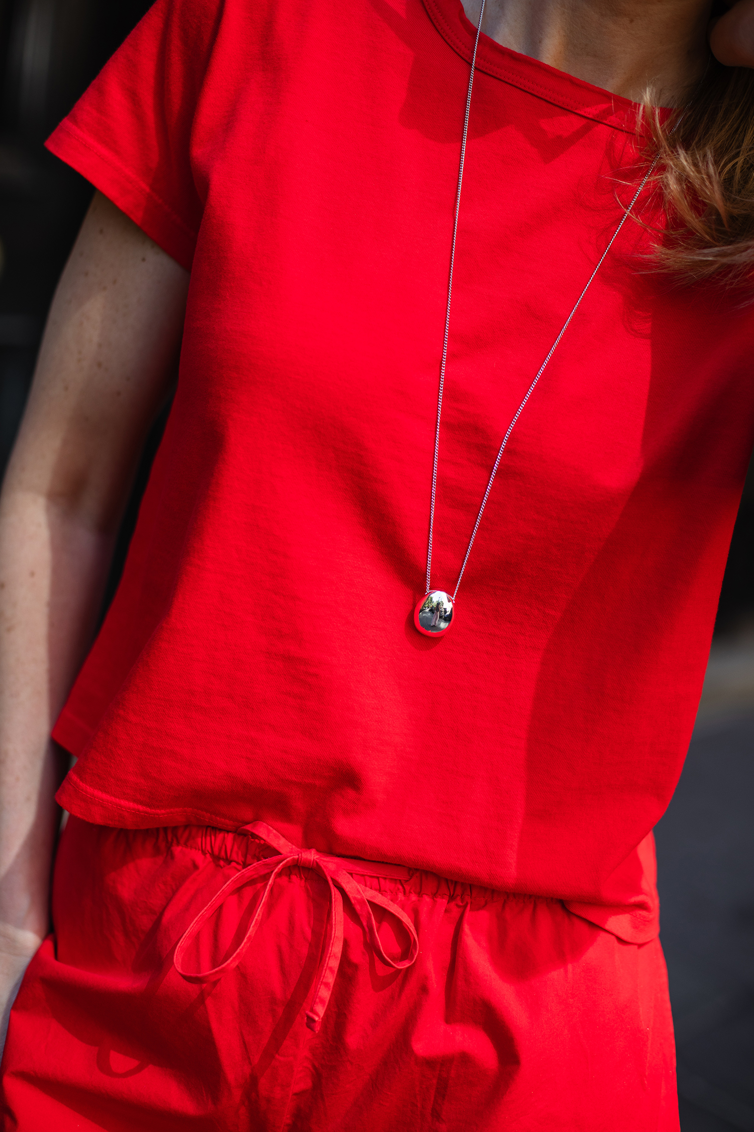 MERRITT BECK IN LESET KYOTO CARPENTER PANTS AND T-SHIRT IN CHERRY RED