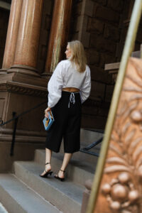 Merritt Beck wearing a Hevron Cropped Shirt and Beaufille Culottes